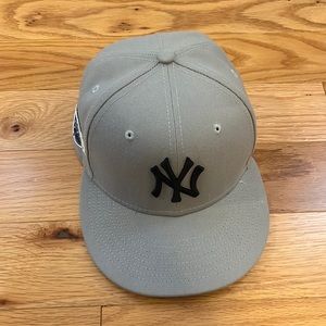 Gray and dark blue Yankees fitted hat.